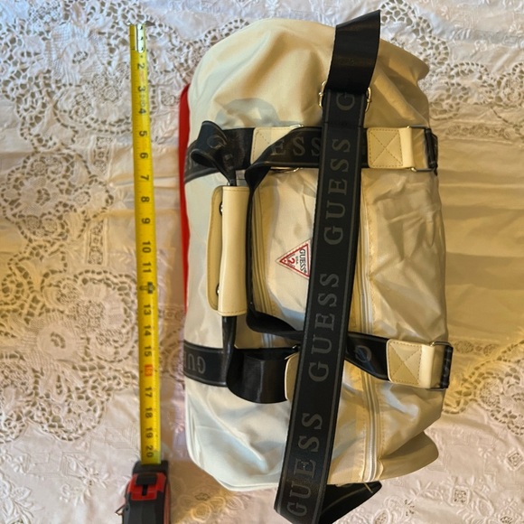 Guess white/cream colored, tote with extra red storage on the bottom. - Picture 4 of 7